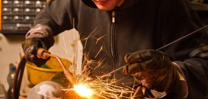 tulityökorttikoulutus-1-300x143 9486288 - worker welding with hot flame and sparks